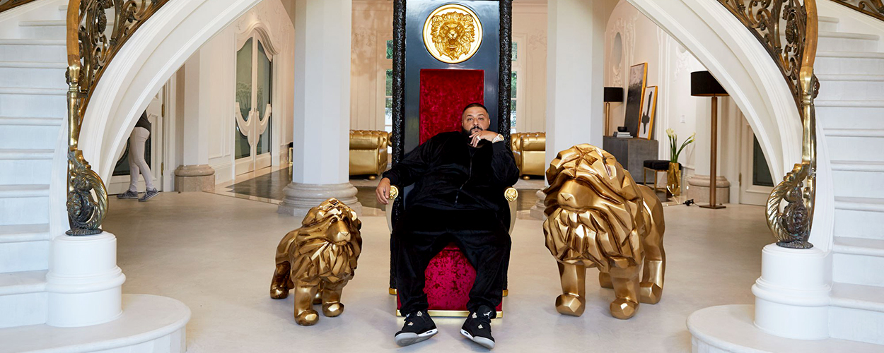 DJ Khaled on a throne flanked by two lion statues
