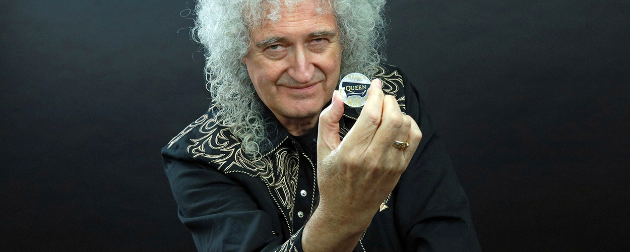Brian May with Queen £5 coin